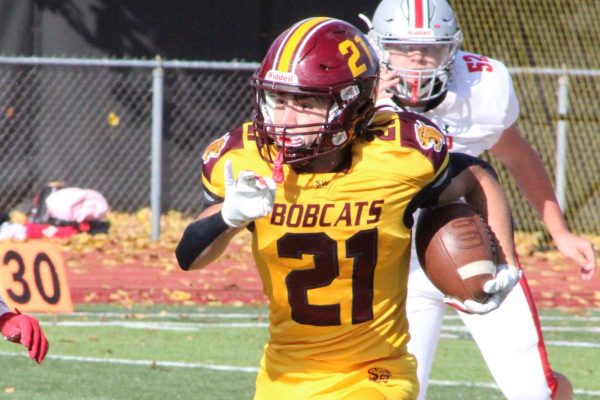 Sophomore Ryan Faux on the way to scoring his first touchdown against Conard. 