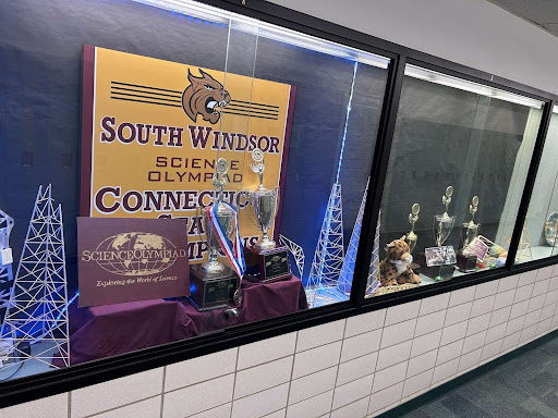 Display case of the Science Olympiad's team trophy in South Windsor High School. 