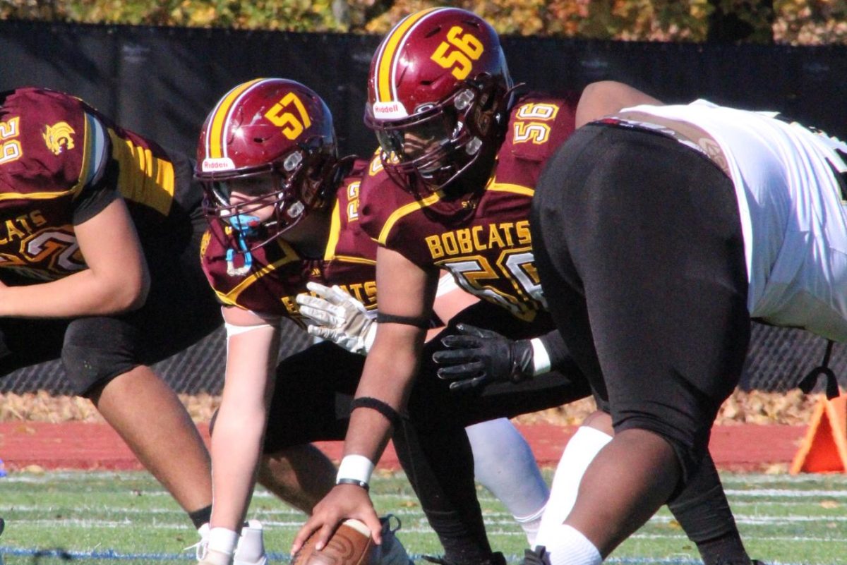 Seniors Nihaal Thakran and Will Campbell line up to snap the ball. 