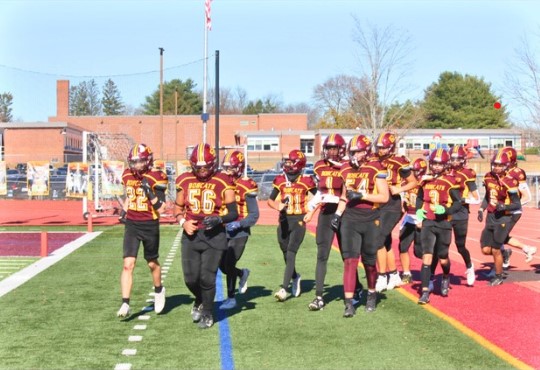 The senior Bobcats leading the team onto the field for their last home game of the season. 