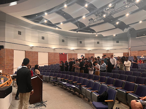 New inductees recite the Science National Honors Society pledge at the ceremony.  (April Davis)