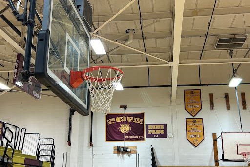 SWHS gym highlighting the victories of the boys basketball team throughout the years.