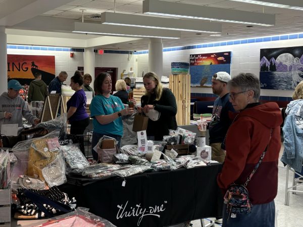 A small business packs away one of their sales from the Craft Fair.