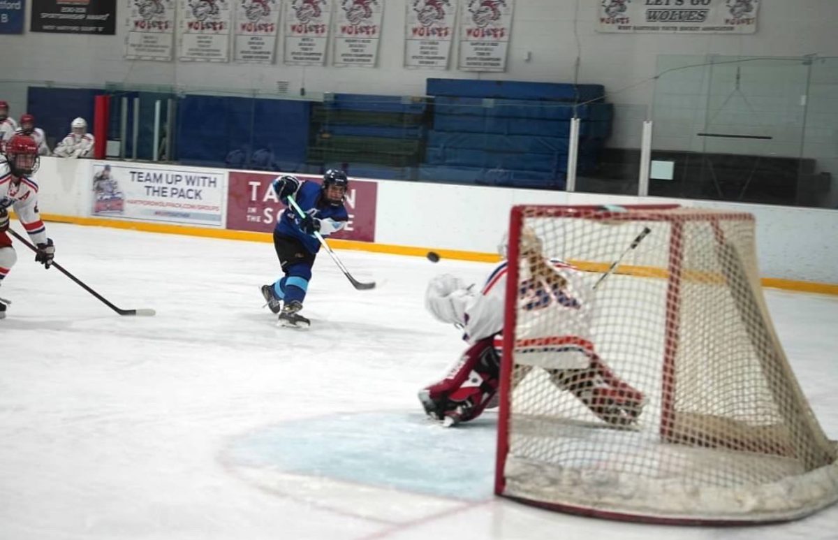 Senior hockey player, Liliana Ficaro, shooting a goal on the ice for the Storm. (Paul Coco)