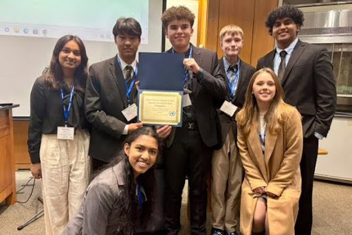 South Windsor High School students presenting their award at the Model UN debate. (Riteesh Ramakrishnan)