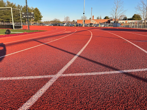 The cold empty outdoor track used by the athletes for meet preparation.