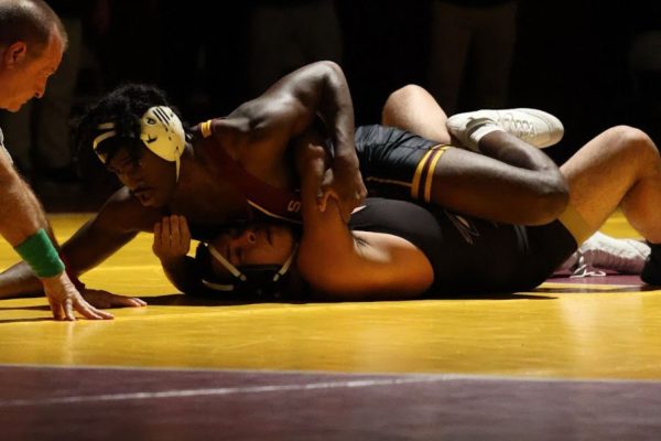 SWHS Senior Jayshaun Barrett pinning his opponent in a wrestling match. (Jalen Canales)