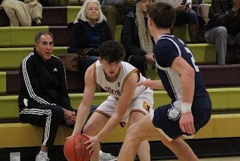 Junior Brayden Edwards tries to fake out a defender during the Bobcats 61-41 victory over Rocky Hill.