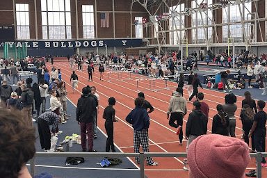  Athletes at Cox Cage track facility warming up and preparing for their upcoming races.
