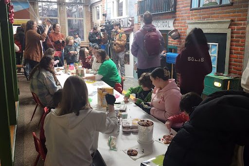 Many families participated in the food craft in the main room of the Lutz Museum.
