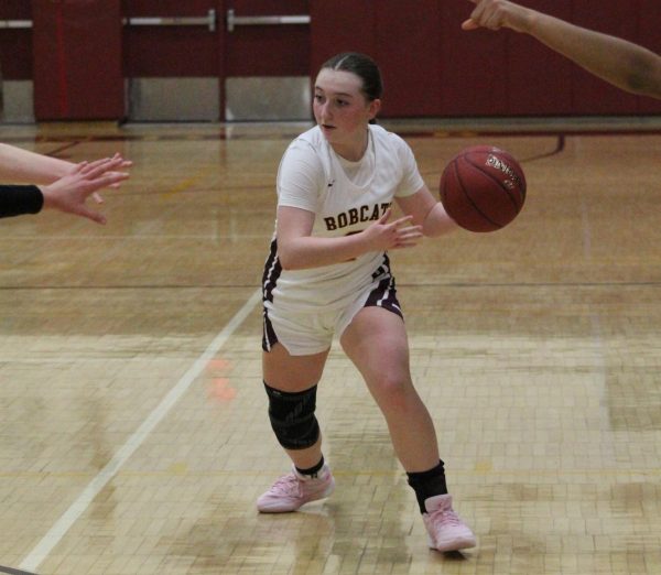 Sophomore Olivia Costello drives to the basket during a game against Granby Memorial.