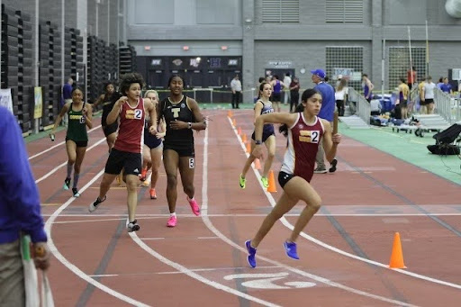 Thaker taking a perfect hand off from teammate Zoe Bailey. (David Hodge)