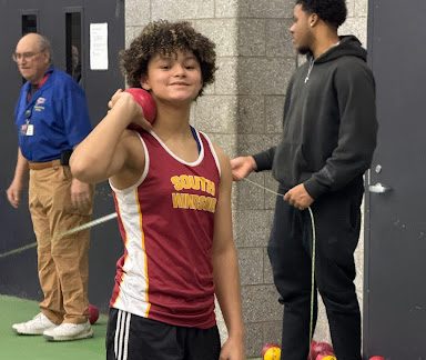 Bailey posing with her Shot Put after an amazing throw. (Zoe Bailey) 

