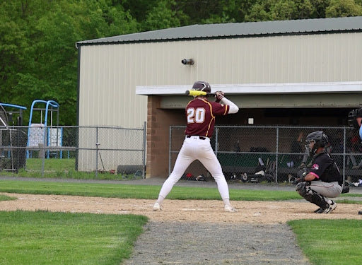 Senior Justin Dittmar prepares to hit during the Bobcats 7-3 win over Manchester.