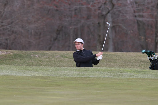 Boys golf team member sophomore Will Ryan takes a swing during practice at top stone golf.