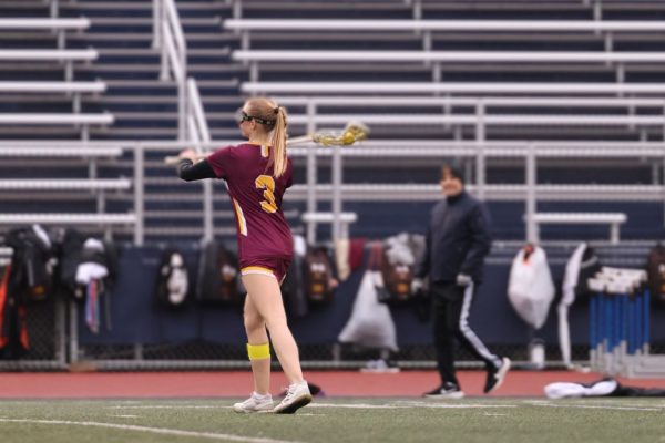 Senior Captain Elise Suffish in midfield passes the ball during the Simsbury game. 