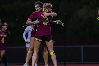 Senior Elise Suffish hugs teammate Lilli Ficaro after the last goal of the game. (Suffish)
