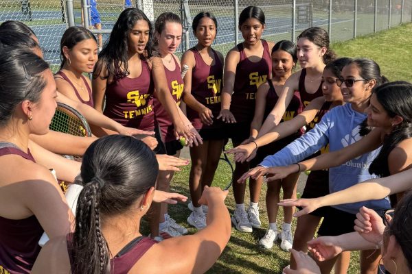 The South Windsor girls tennis team gets together for a team huddle before a home game.  (Mrs. Belval)