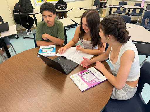 Students studying together to prepare for the reading and writing portion of the SAT exam.