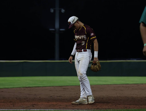 Senior Sam Balducci returns to third base before the seventh inning of the Bobcats 5-2 semifinal win.