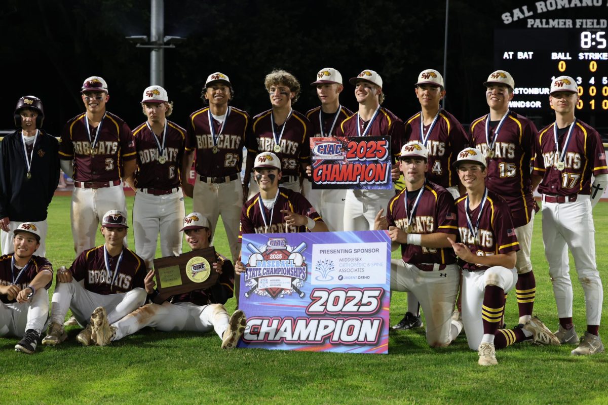 The South Windsor High School baseball team poses with the trophy after winning the Class LL State Title.