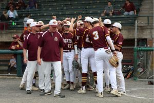 The South Windsor Bobcats gather as a team prior to a game at Muzzy Field