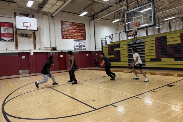 Students playing basketball together during physical education class at SWHS.