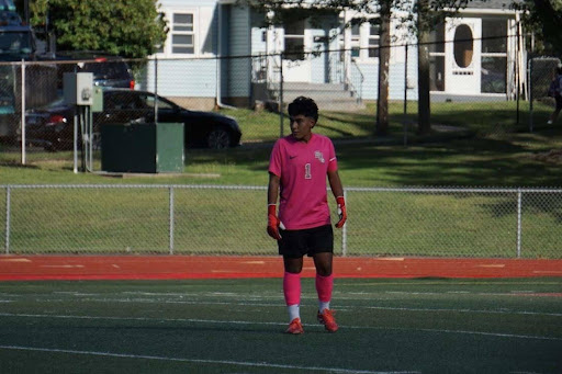 Junior Franchesco Linares stands in front of the goal ready to block the shot.