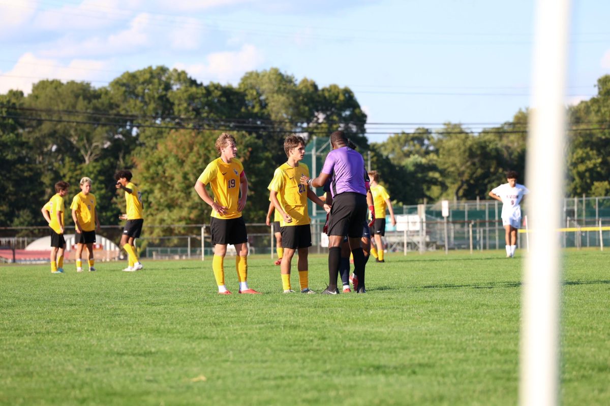Captains Hayden Xhokaxhiu, Jaxson Hills, and Franchesco Linares protest the controversial call with the referee.