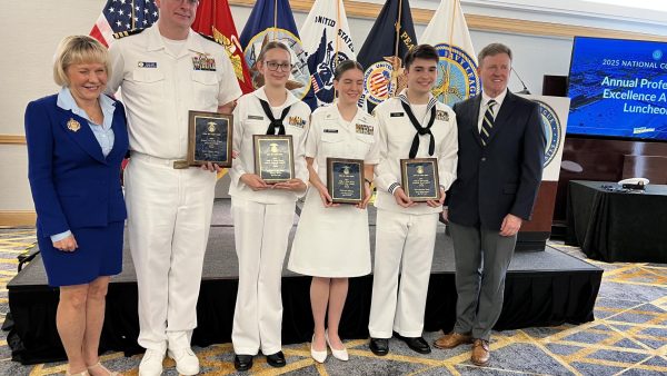 Junior Alex Fetzko holds his award with other recipients from the Sea Cadet program. (Photo courtesy of Mrs. Fetzko)