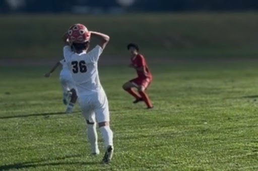 Sophomore, Mateo Heredia, taking a long throw to freshman, Adam Elsendyouney. (Photo taken by Mrs. Elsendyouney)