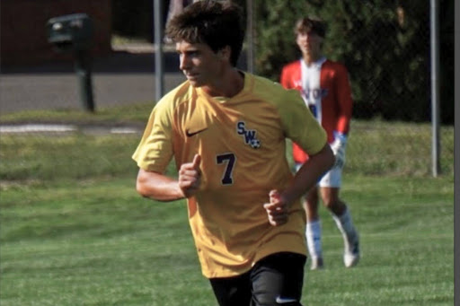 Junior, Riley Lyons running to get the ball against Avon.