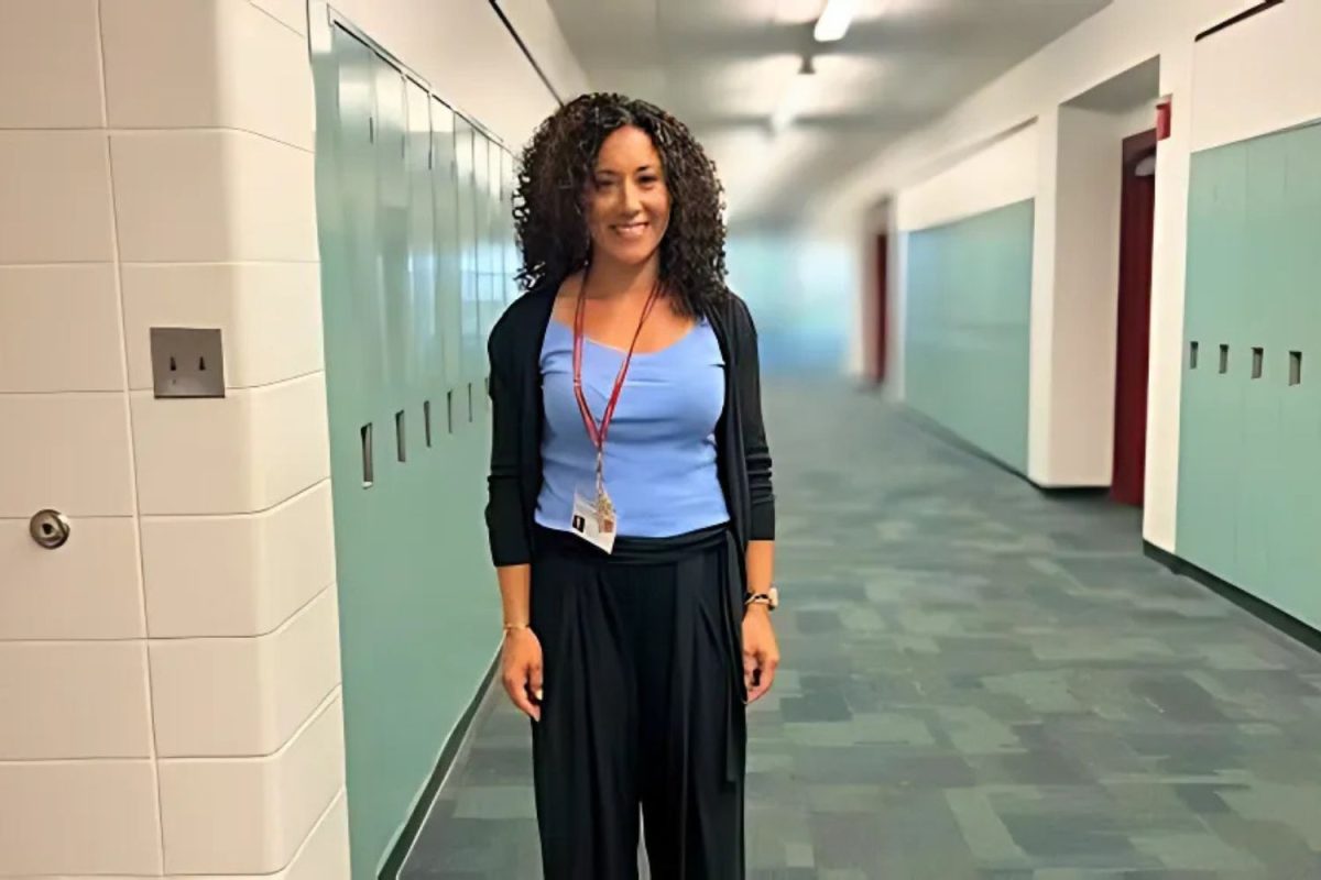 Newly hired math teacher at South Windsor High School, Ms. Taryn Lavoie, stands in front of her classroom.  