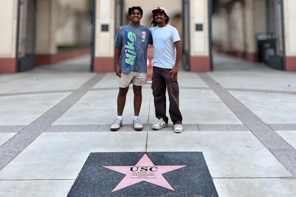 Students Aneek and Aneesh Roy in front of USC cinematic arts school where they learn media. (Photo courtesy Aneesh Roy)