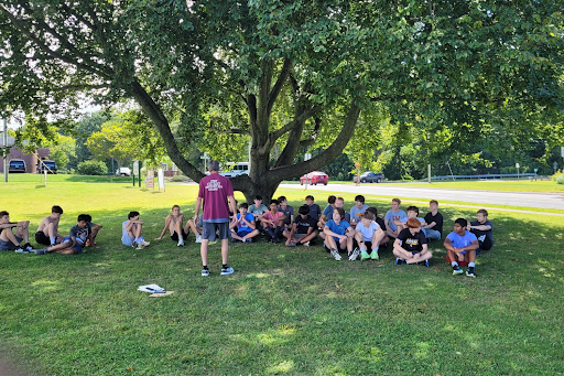 Boys Cross Country, Coach Anthony speaking to the team during practice