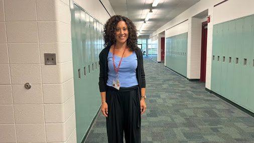 Newly hired math teacher at South Windsor High School, Ms. Taryn Lavoie, stands in front of her classroom.  