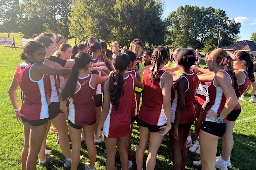 Girls Cross Country team cheers loudly at the race start.