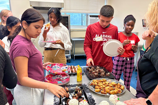 Members gather and eat buffet-style to enjoy all of the dishes.