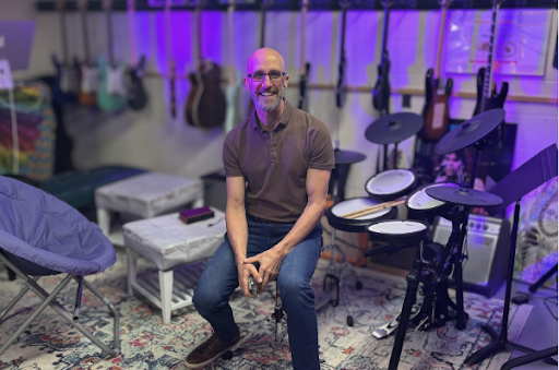 The Teacher of the Underground Music Club, Mr. Crowley, sitting in the music room.
