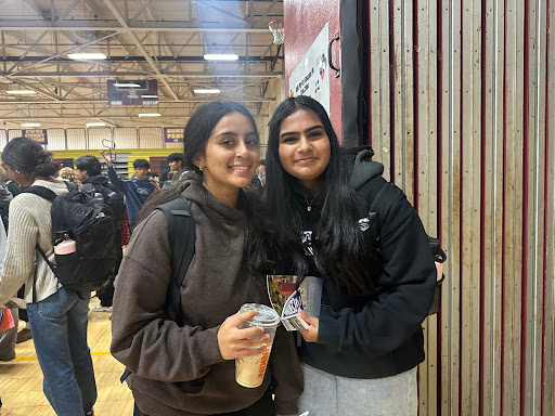 Juniors Sanjana Aturi and Pooravi Srivastava scout out colleges of interest at the college fair.