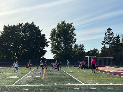 Senior Captain, Izzy Dziubin breaking through Newington defense and running the ball to the goal. 
