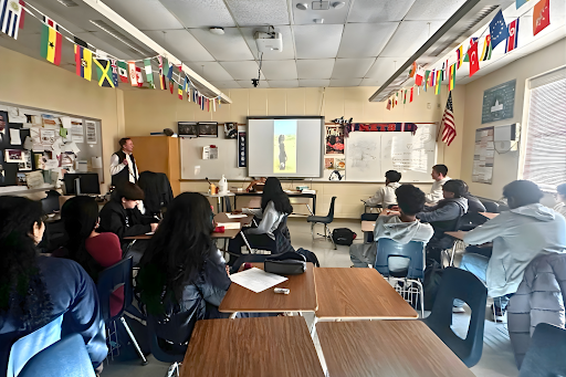 Students are watching a group video on the telegraph in APUSH class.
