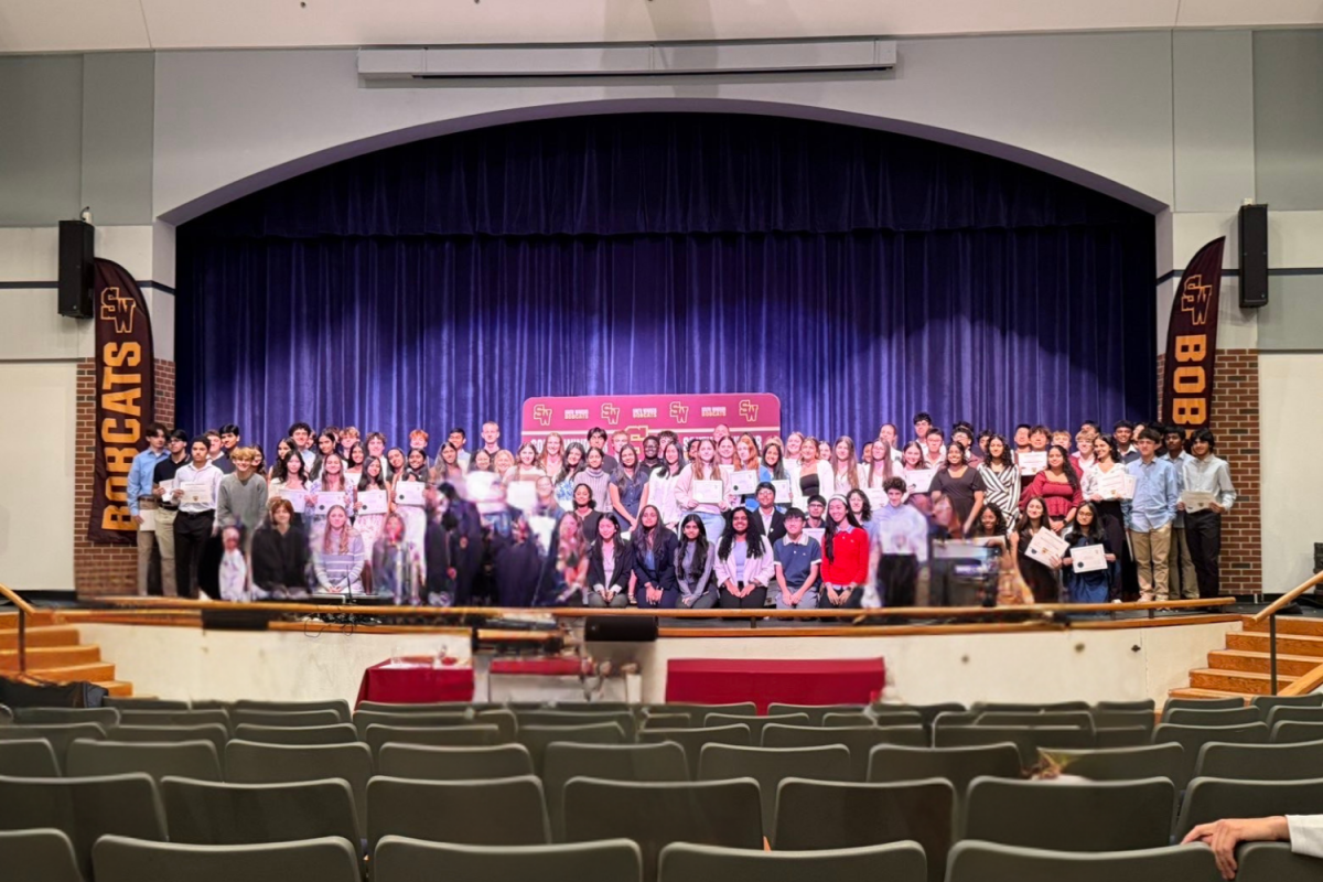 Newly inducted members of the Science National Honors Society and Mu Alpha Theta stand together for a photo