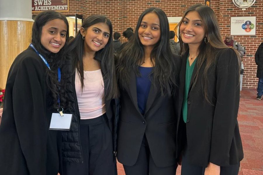 Model UN Seniors in the South Windsor High School lobby preparing to head into debate at the conference. (Chaitanya Jegannathan) 