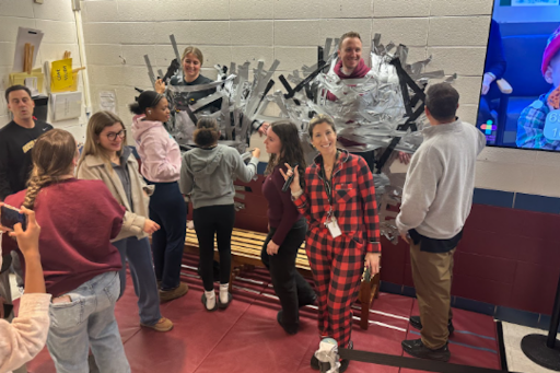 People in pajamas participating in the Tape-The-Teacher challenge to raise money for Connecticut Children’s Medical Center.