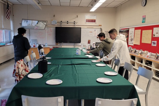 Students setting up plates for Thanksgiving feast in Food Prep Class