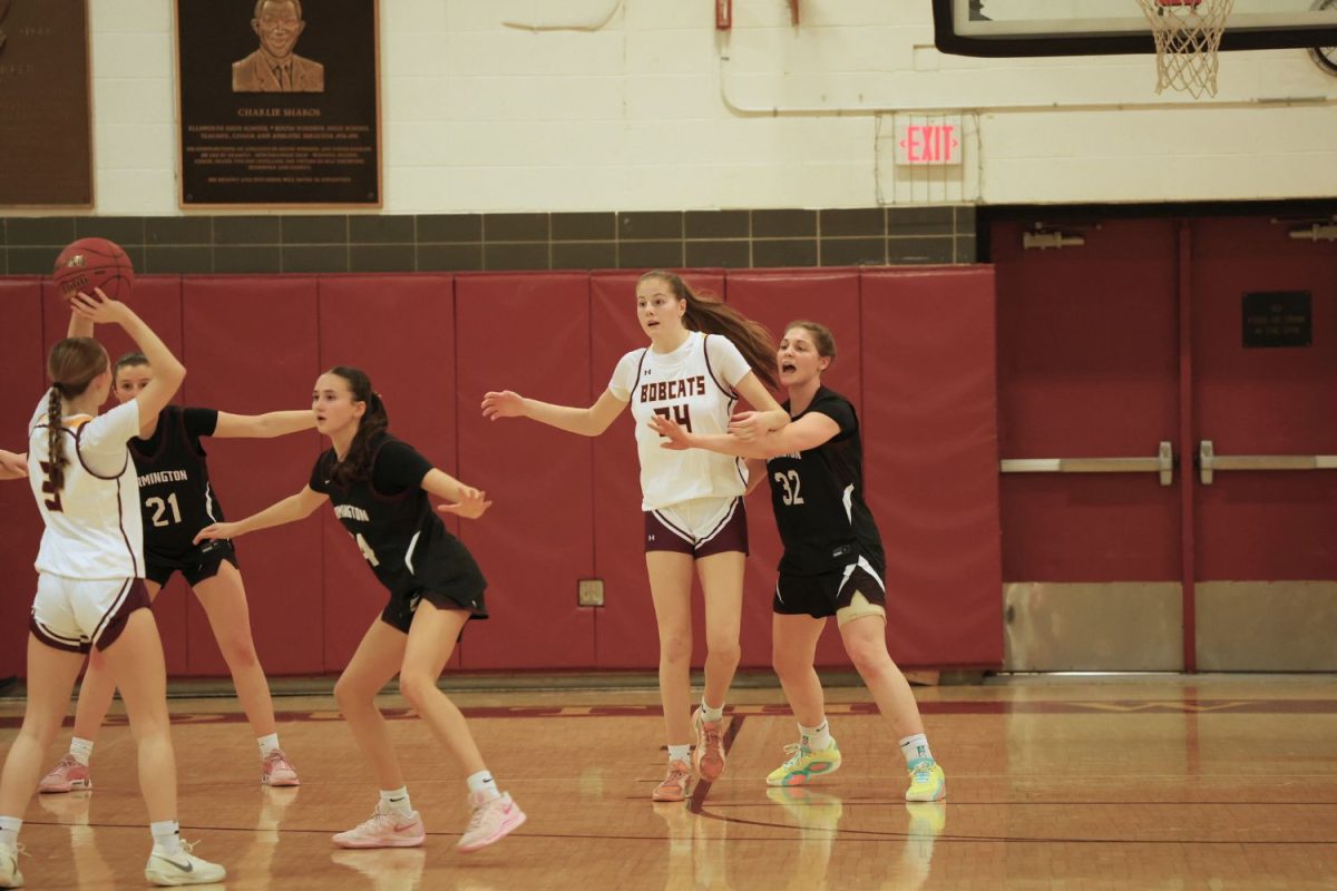 Freshman Elise Glunt posts up against a Farmington player in their game. 