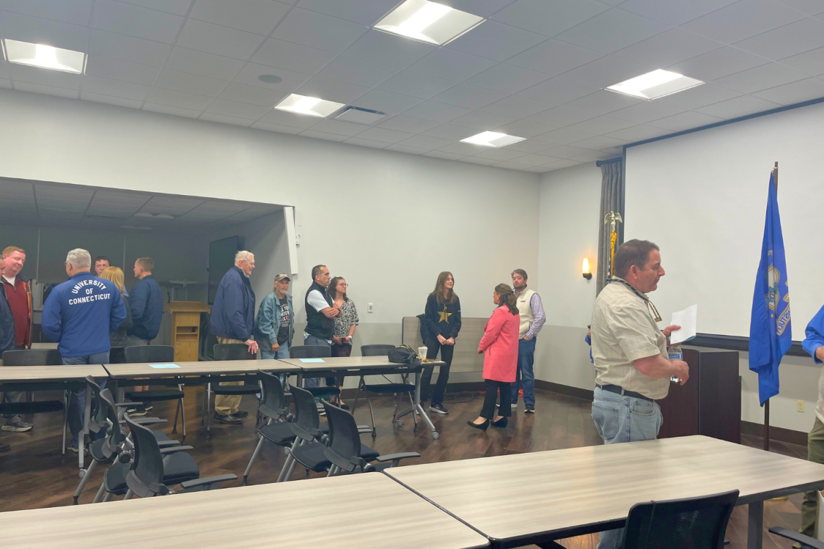 Interested attendees line up to talk with candidate Erin Stewart.