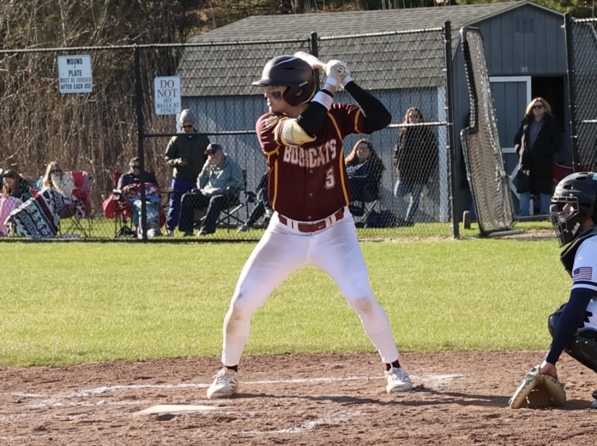 Senior Brayden Edwards steps to bat before hitting a home run against Avon.