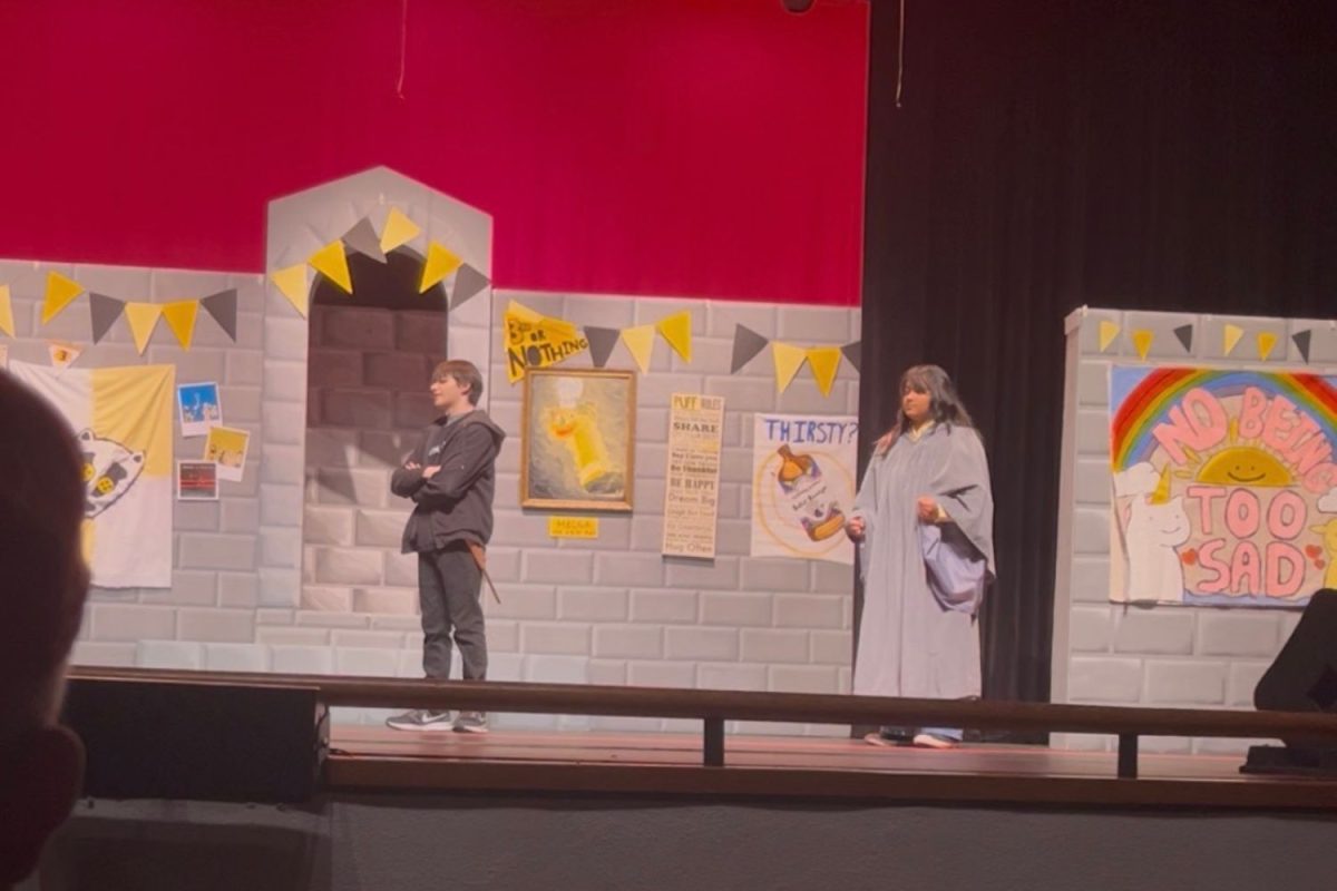 Dumbledore speaks to Wayne in this scene during part 5 of the Puffs performance. 